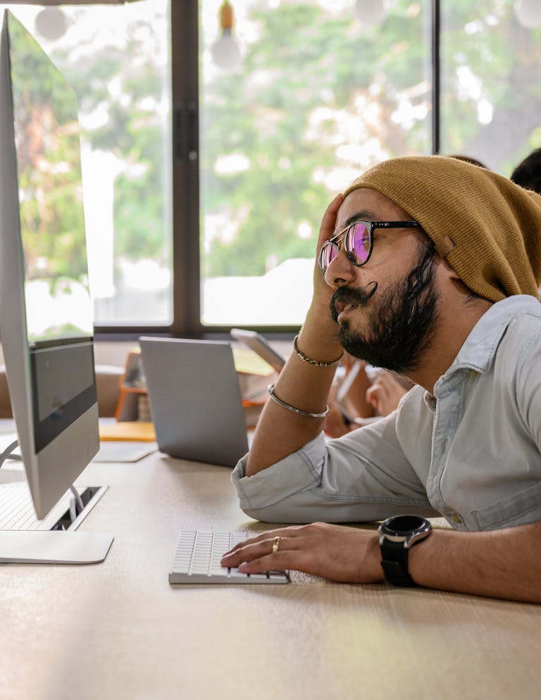 A Mas Using a Computer at Work